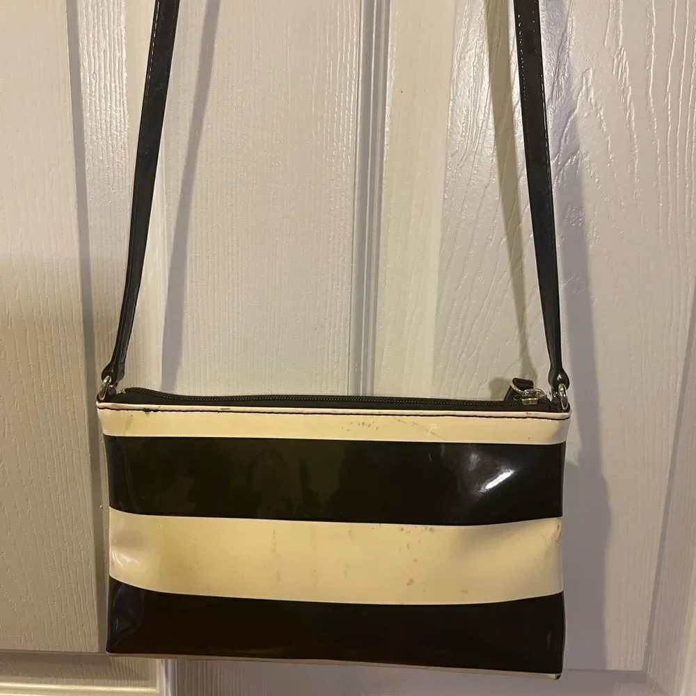 Kate Spade patent Black and Cream Striped small Crossbody Bag.